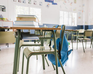 Empty classroom chair. Who's Really Responsible for Keeping Our Kids Safe in School?